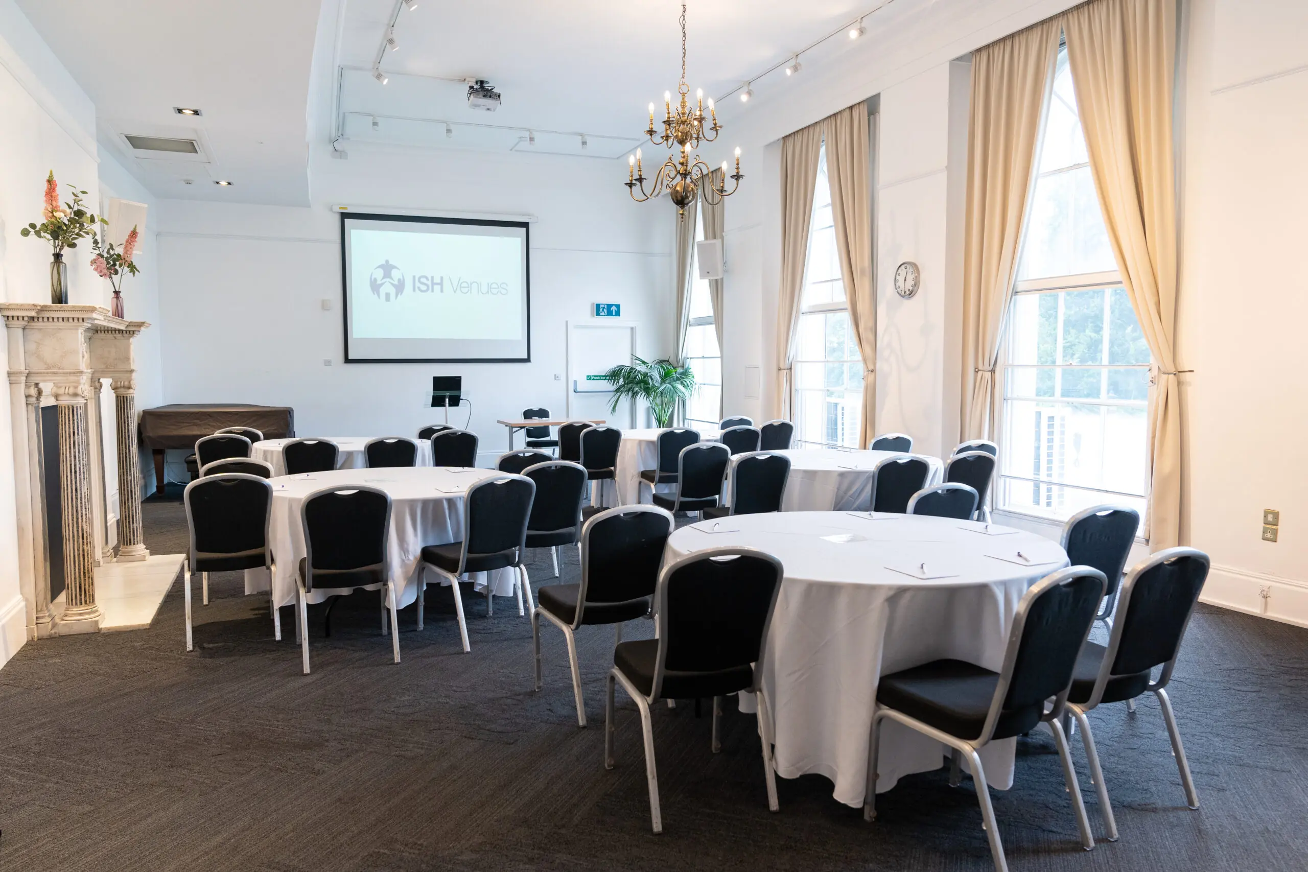 A conference room with round table seating